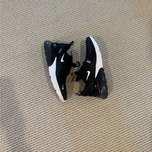 Nike Women’s Black and White Sneakers *holes in on toe area* (see pictures)